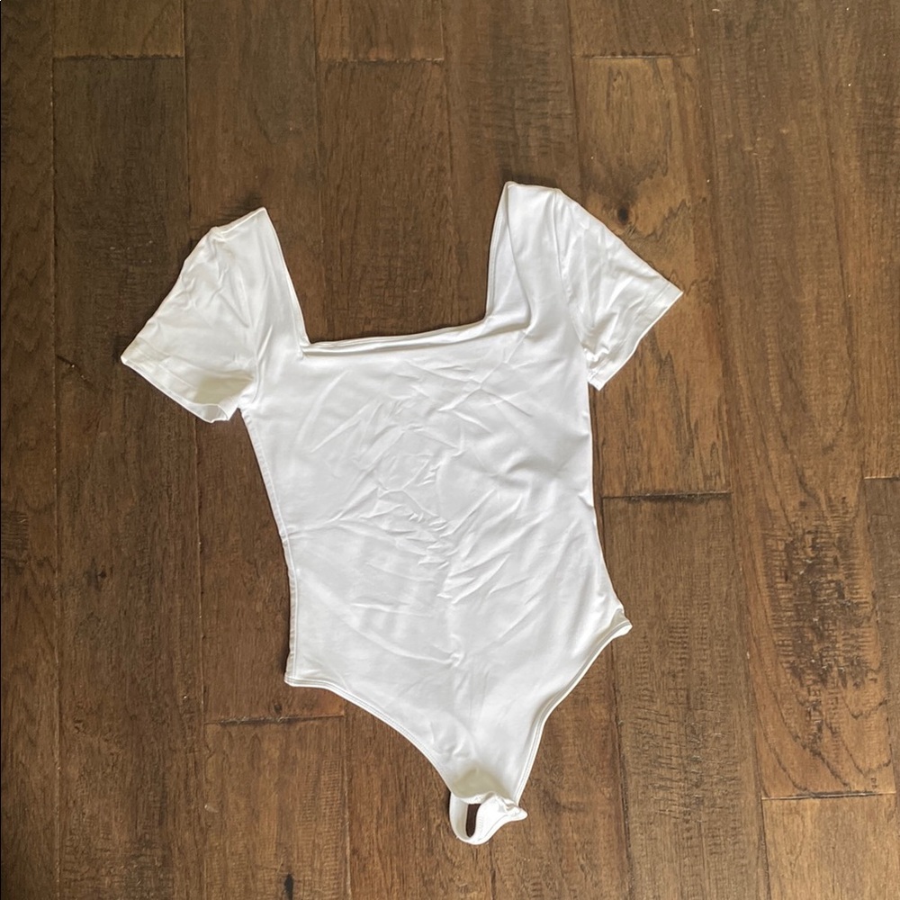 Babaton Women’s White Short Sleeve One-Piece Bodysuit